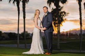 Phoenix wedding photograph of bride and groom at sunset with palm trees