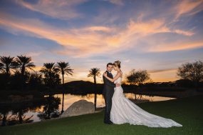 Phoenix wedding photograph of bride and groom at sunset with palm trees