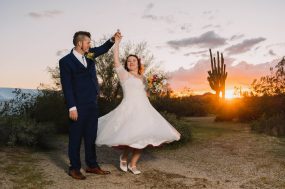 Phoenix wedding photograph of groom spinning bride at sunset