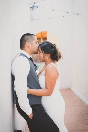 Phoenix wedding photograph of groom kissing bride’s forehead