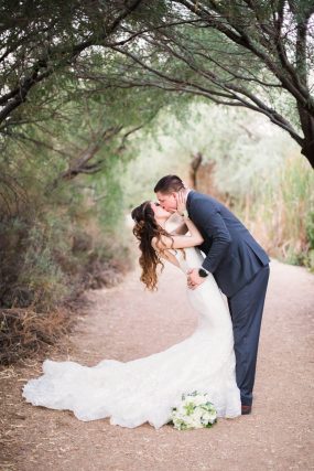 Phoenix wedding photograph of couple kissing on country road