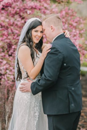 Phoenix wedding photography of bride and groom with cherry blossoms