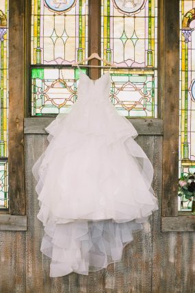 Phoenix wedding photography of bridal gown in church