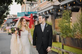Phoenix wedding photograph of bride and groom walking down street