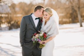 Phoenix wedding photography of bride and groom in snow