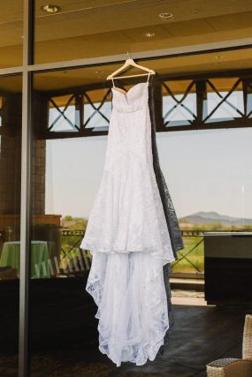 Phoenix wedding photography of bride’s dress hanging up