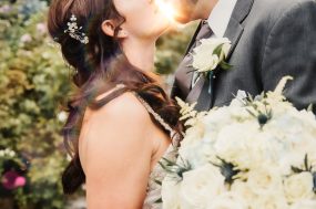 Salt Lake City wedding photograph of a sunlit kiss