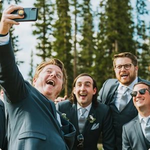 Groomsmen taking a selfie by Denver wedding photographers, Wanderlight