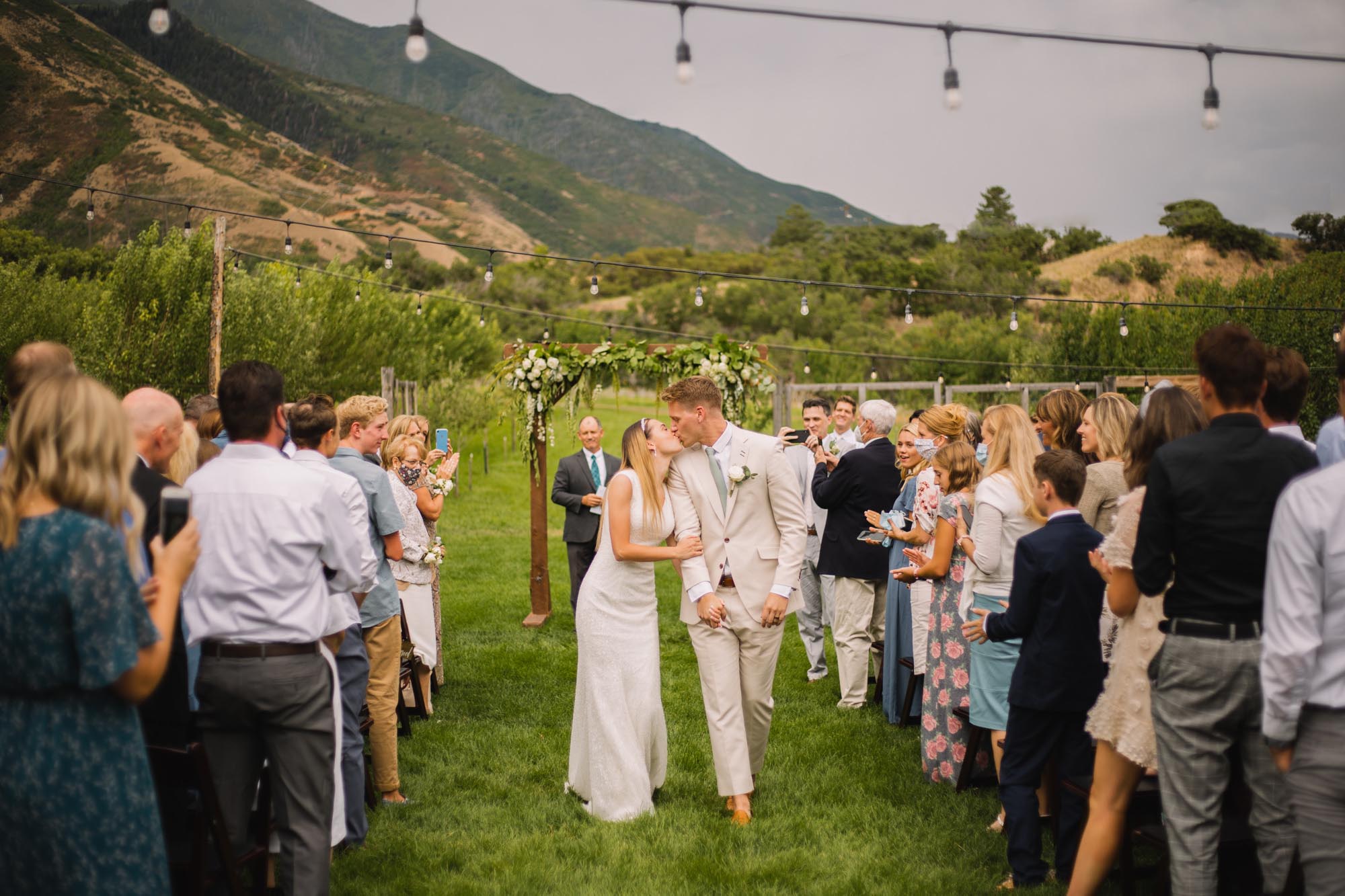Ceremony kiss at vineyard in Utah by Wanderlight, a Salt Lake City wedding photography company